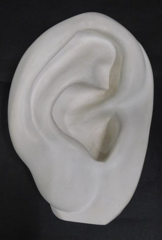 A museum type resin composition bowl, modelled in the form of an ear, indistinct stand and titled Echo, 20cm wide.