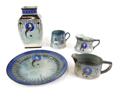 A collection of Royal Doulton Titanian wares, to include vase and other pieces decorated with an exotic bird, within brown bands, and a Tutankhamen's Treasures Luxor mug. (5)