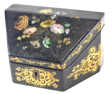 A Victorian papier mache stationary box, decorated overall with flowers, etc., inlaid in mother of pearl, picked out in gilt, the hinged lid enclosing a fitted interior and compartment for matches, 18cm wide.