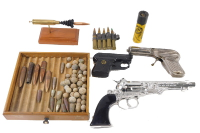A Rohm RG3 starting pistol, various bullets, musket balls, etc.