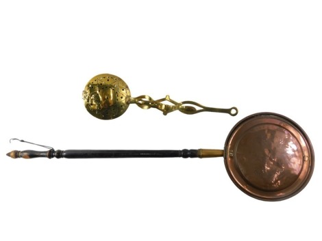 A Victorian engraved brass warming pan, with ebonised handle, 112cm long, and a 19thC pierced brass chestnut roaster, with shaped handle, 58cm long.