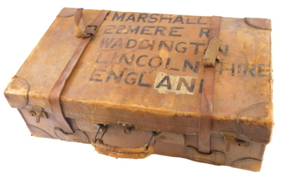 A leather suitcase, stamped Marshall 22 Mere road Waddington Lincoln. (AF)