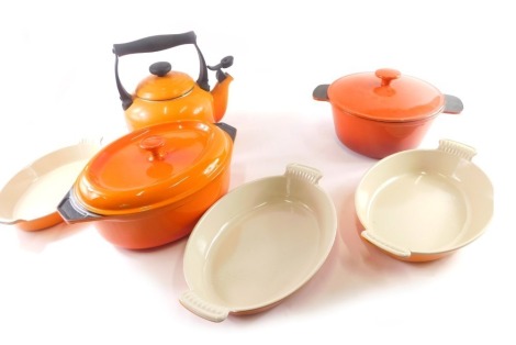 A quantity of Le Creuset pans and other kitchenware, to include a tureen and cover, three oval dishes, circular tureen and cover, and a kettle.