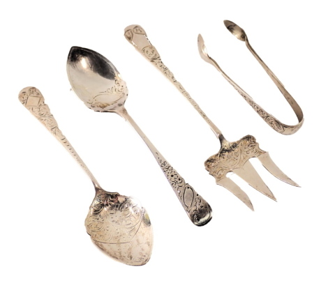 A group of assorted silver cutlery, comprising two silver fiddle pattern and floral edge serving spoons, a pair of miniature silver sugar tongs, and a pickle fork, 2.71oz. (4)