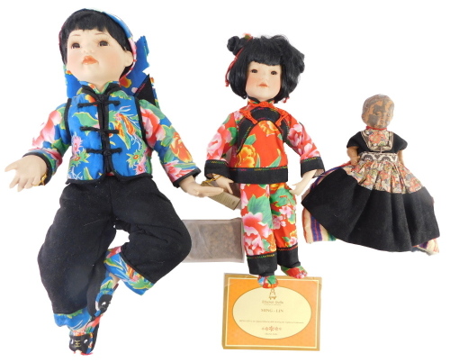 Two Oriental style costume dolls, and an early 20thC composition doll.