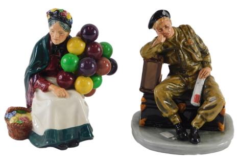 A Royal Doulton porcelain figure, The Railway Sleeper, and another The Old Balloon Seller. (2)