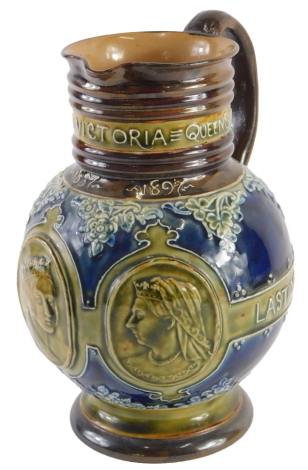 A large Doulton Lambeth stoneware Queen Victoria commemorative jug, 1837-1897, decorated with Victoria in profile, in green on a blue ground with brown borders, impressed marks to underside, 23cm high.