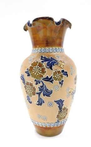 A Doulton Slaters Patent stoneware vase, with a fluted rim, with raised relief floral body, stamped to underside, 21cm high.