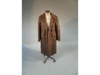 An early 20thC fur coat.