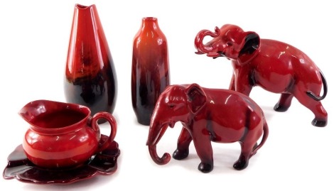 Royal Doulton Flambe items, comprising two vases, 15cm and 12cm high, two elephants, 13cm and 8cm high, and a milk jug and pin dish. (6)