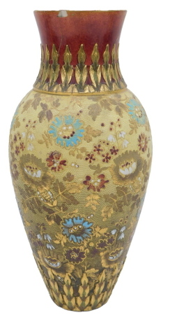 A Royal Doulton vase, with a red glazed and tulip stem, on a yellow and gilt blue and red flowered body, stamped to underside, 32cm high. (AF)