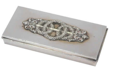 A Russian Odessa silver stamp case, 1908-1926, with a wreath and bow raised design, 11cm wide, 7.32oz.