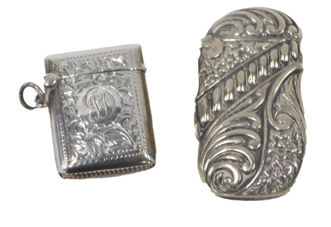 A George V silver match case, with embossed floral decoration bearing the initials JD, Birmingham 1919, 0.60oz, and a silver plated Continental example. (2)