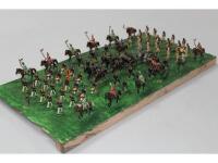 Various metal die-cast soldiers painted in Prussian and Napoleonic uniforms with horse artillery