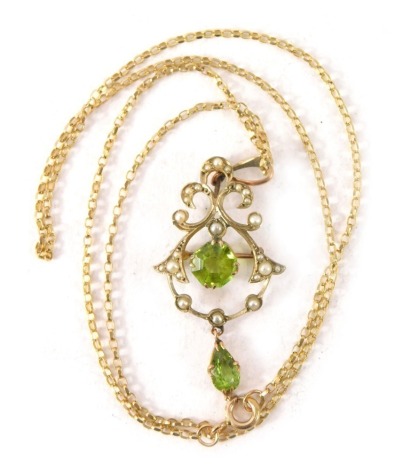 An Edwardian style pendant and chain, the arched pendant set with peridot and seed pearl, with a brooch back and pendant mount, 5cm high, on a later fine link 9ct gold neck chain, 50cm long, 5.1g all in.