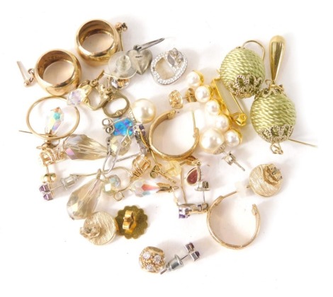 A group of costume jewellery earrings, knotted ball drops, hoops, studs, etc. (a quantity)