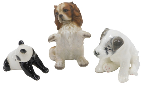 Three ceramic animals, comprising a USSR panda, a HHH Cavalier king Charles 13cm high, and a USSR seated puppy, 11cm high. (3)