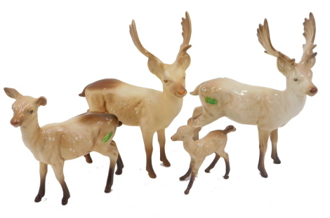 Four Beswick deer, comprising a matt glazed stag, a deer, fawn and foal. (4)