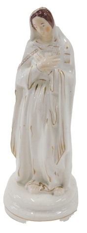 A 19thC Staffordshire flatback style figure, depicting The Virgin Mary, on circular base, with gilt highlights, 27cm high.