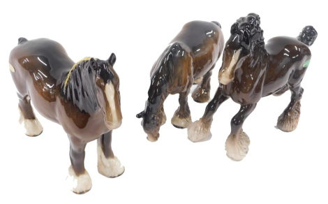 Three Beswick shire horses, each in varying pose, 20cm, 16cm and 21cm high. (3)