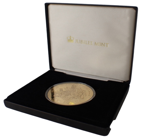 A Jubilee Mint Duke and Duchess of Cambridge collectors gold plated silver proof 5oz coin, for His Royal Highness Princes George of Cambridge 1st Birthday, boxed with certificate of authenticity.