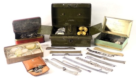 A group of clock and watch parts, comprising clock faces, bracelets, watch chains, etc. (1 tray)