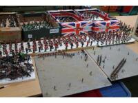 A large collection of plastic Britains' soldiers and a diorama set of miniature toy soldiers depicti