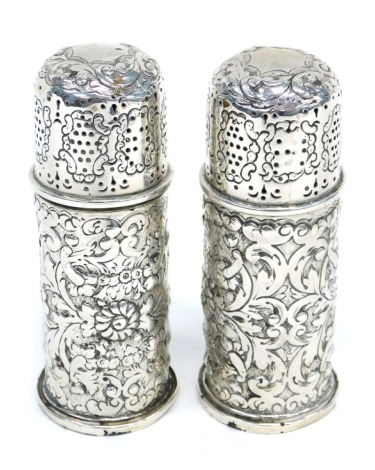 A pair of Georgian silver salt pots, with embossed decoration, London 1890, marks rubbed, 4.22oz.