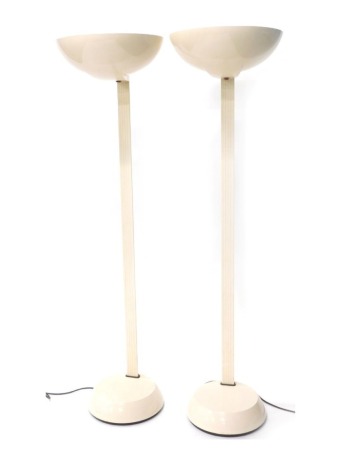 A pair of Thorn retro cream uplighters, each on a metal stand with plastic shades, 183cm high. Buyer Note: WARNING! This lot contains untested or unsafe electrical items. It is supplied for scrap or reconditioning only. TRADE ONLY