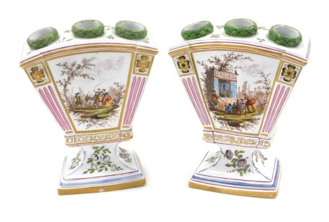 A pair of Verve Perrin Marseilles Faience flower vases, each decorated with a child and two figures with donkey, and a Punch and Judy show, 19cm high.