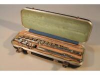 A Boosey and Hawkes imported "la couture" stainless steel flute in case.