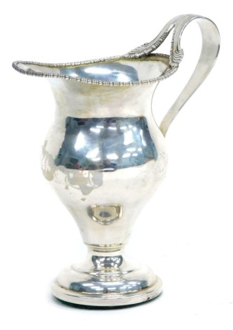 An Edward VII silver pedestal cream jug, Chester 1909, weighted base.