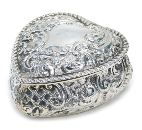 An Edward VII silver heart shaped trinket case, with embossed decoration, Chester 1901, 1.3oz.