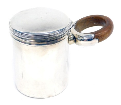 A Victorian silver lidded canister, with turned wooden loop handle, London 1837, 7oz all in, 9cm high.