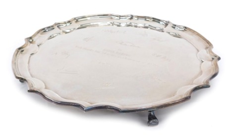 An Elizabeth II silver salver, raised on four scroll feet, inscribed To Robin Waring, Sheffield sterling, 30oz.