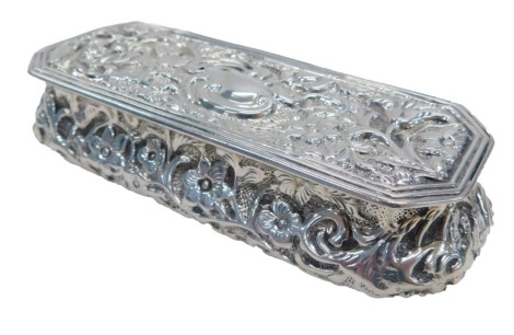 A Victorian silver cushion shaped rectangular dressing table case, with embossed decoration, Birmingham 1898, 1.83oz.