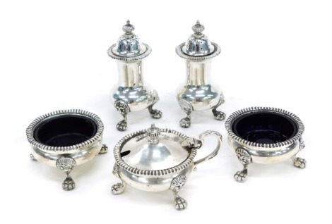 A pair of Elizabeth II silver salt pots, with blue liners, Birmingham 1954, a matched mustard port with hinged lid, Birmingham 1953, and a matched pair of silver pepper pots, Birmingham 1953/54, approx 12oz (excluding liners).