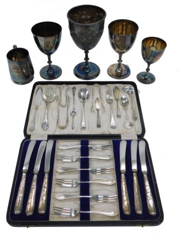 A Victorian silver plated challis, engraved to a Robert Butler, four sporting silver plated cups, six silver handled dessert knives, etc.