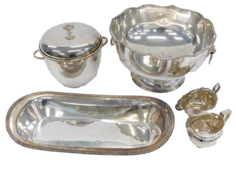 Silver plated wares, comprising a silver punch bowl with lion mask handles, oblong rope twist bordered serving tray and two sauce boats. (4)