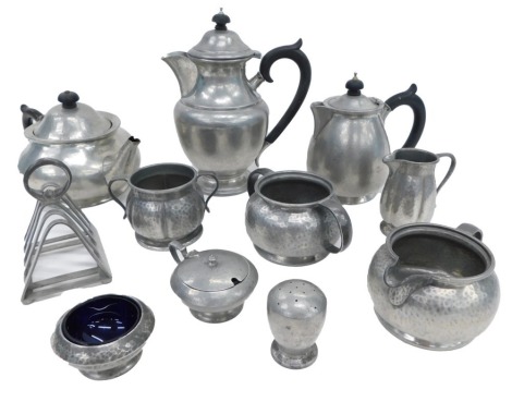 A group of Tudric pewter teawares, comprising a four piece part tea service, toast rack, preserve pots, mustard pots, etc. (a quantity)