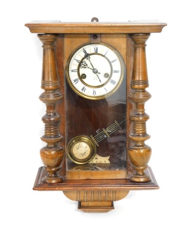 A late 19th/early 20thC Junghans Vienna wall clock, in a stained beech case.