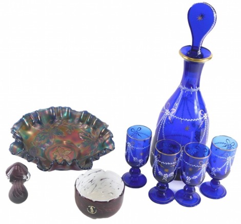 A blue glass liqueur set, comprising decanter and stopper, four glasses, blackcurrent carnival glass bowl, etc.