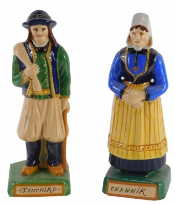 A pair of Henriot Quimper Faience figures, of gentleman and a lady stamped Fanchik and Channik respectively, 25cm high.