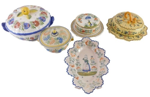 A late Quimper Faience tureen and cover, decorated with flowers and leaves, a butter dish and cover, etc.