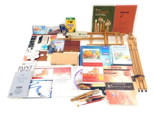 A large quantity of artists materials, to include paper, books, easels, etc.