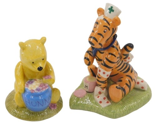 A Royal Doulton Winnie The Pooh figure of Nurse Tigger, and a figure of Winnie The Pooh 'All the Flowers are waking up'. (2)