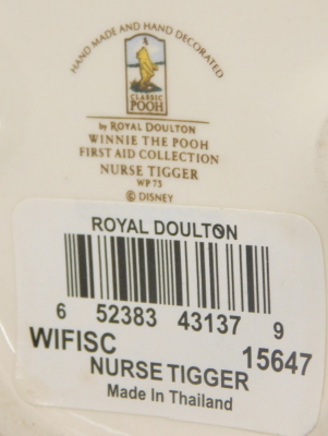 A Royal Doulton Winnie The Pooh figure of Nurse Tigger, and a figure of Winnie The Pooh 'All the Flowers are waking up'. (2) - 2