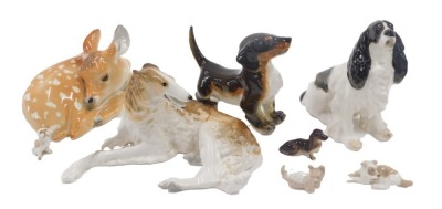 A collection of Russian USSR porcelain dogs, to include Bortzoi, Spaniel, Dachshund and a recumbent deer. (a quantity)