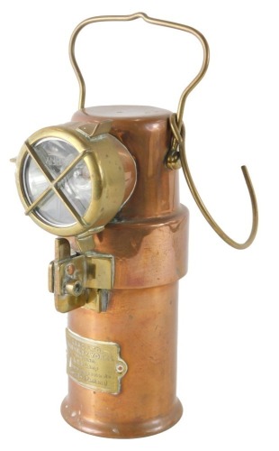 A brass and copper railway inspection lamp, bearing crest C E A G Limited of Barnsley York, B.E.3. inspection lamp, with swing handle, 16cm high.