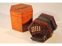 An early 20thC mahogany cased concertina